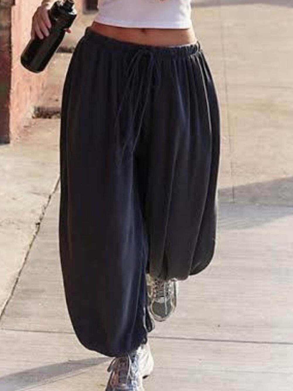 Free People Movement Momentum balloon pants in dark gray. They are loose-fitting